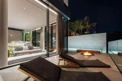 a living room with a couch and a table at Saudade Residence - Ultra Luxury Futuristic Ocean Zen Retreat in Ribeira Brava