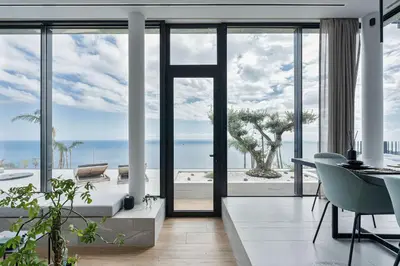 an open living room with a view of the ocean at Saudade Residence - Ultra Luxury Futuristic Ocean Zen Retreat in Ribeira Brava