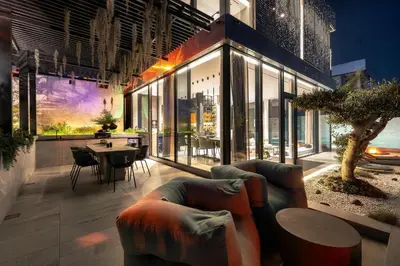 a living room with a couch and a table at Saudade Residence - Ultra Luxury Futuristic Ocean Zen Retreat in Ribeira Brava