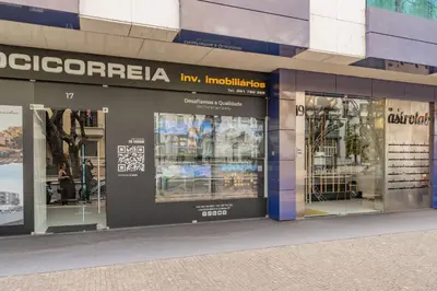 a store front of a building with glass windows at FLH Funchal Elegant Apartment with Pool & Balcony in Funchal