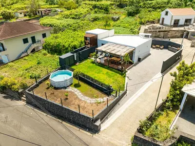 an aerial view of a house with a yard at Fajã Lodges - House Ash in São Vicente