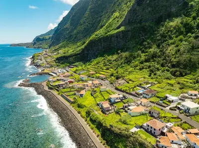 an aerial view of a village on the side of a mountain at Fajã Lodges - House Ash in São Vicente