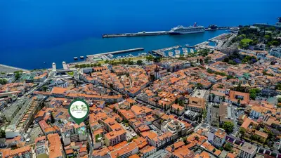 an aerial view of a city with a cruise ship at Green Living-Funchal in Funchal