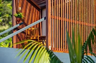 a porch of a house with a plant on it at Fajã Lodges - Studio Ash in São Vicente