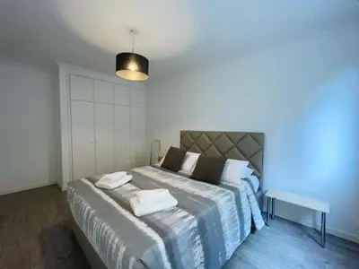 a bedroom with a bed with towels on it at Piornais Apartment by Susys Holidays in Funchal