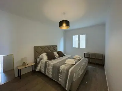 a bedroom with a large bed and a window at Piornais Apartment by Susys Holidays in Funchal