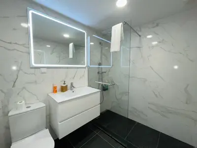 a bathroom with a toilet and a sink and a shower at Piornais Apartment by Susys Holidays in Funchal