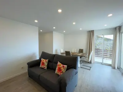 a living room with a couch and a table at Piornais Apartment by Susys Holidays in Funchal