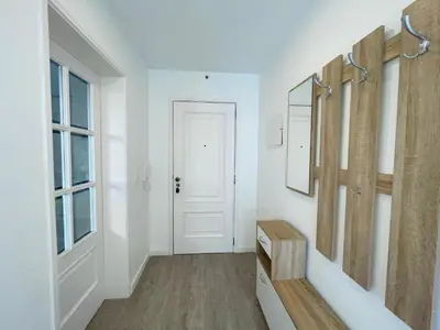a hallway with a mirror and a white door at Piornais Apartment by Susys Holidays in Funchal