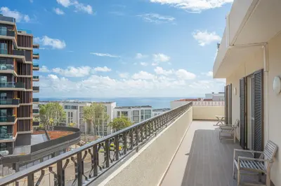 a balcony with a view of the ocean at Portola Penthouse by YMR in Funchal