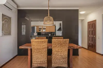 a bedroom with a bed and a nightstand with towels at Portola Penthouse by YMR in Funchal