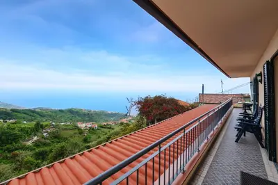 a balcony with a view of the mountains at Miradouro House By Sam Houses in Ponta do Sol