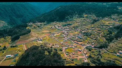 an aerial view of a village in the mountains at Pôr do Sol II in Porto Moniz