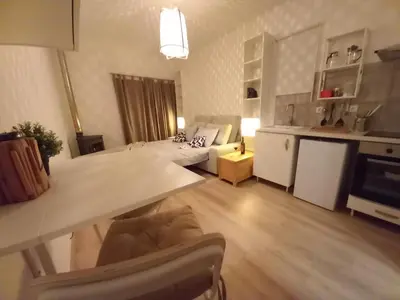 a living room with a couch and a table at The Studio in Aljezur