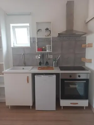 a kitchen with a sink and a stove at The Studio in Aljezur