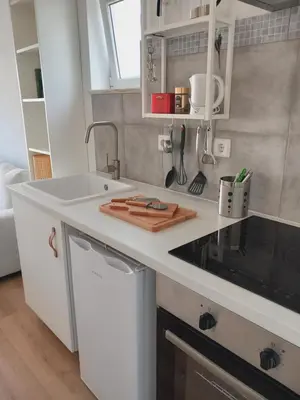 a kitchen with a sink and a counter top at The Studio in Aljezur