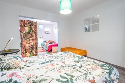 a bedroom with a bed with a colorful bedspread at Casa de Campo Serrão in Calheta