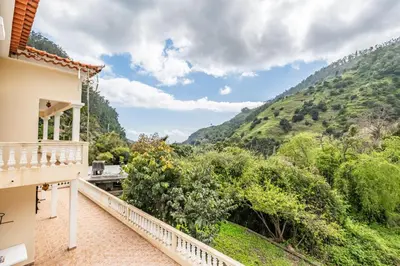 a balcony with a view of a mountain at Valley Nest by Zest and Guest in Ribeira Brava