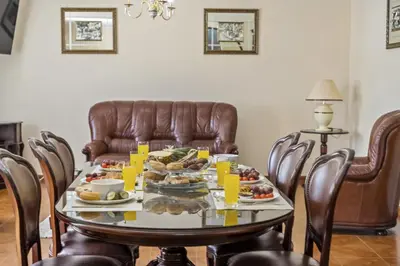 a table with food on it in a living room at Valley Nest by Zest and Guest in Ribeira Brava
