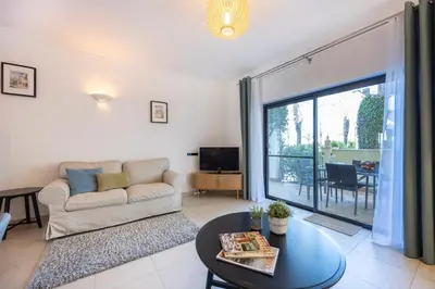 a living room with a couch and a table at Lagos Bay Apartment in Lagos