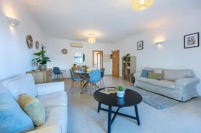 a living room with a couch and a table at Lagos Bay Apartment in Lagos