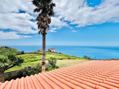 a bedroom with a large bed in a attic at Oasis in Madeira by YMR in Raposeira do Logarinho