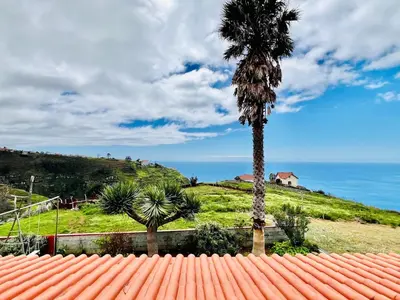 a tv sitting on top of a wooden cabinet at Oasis in Madeira by YMR in Raposeira do Logarinho