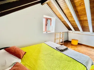 a bathroom with a toilet in a wooden wall at Oasis in Madeira by YMR in Raposeira do Logarinho