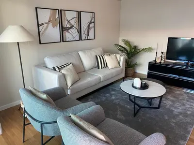a living room with a couch and a table at Modern Urban Apartment in Funchal
