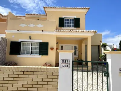 a house with a gate in front of it at Porto de Mós Family House in Lagos