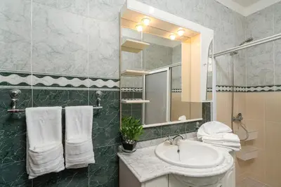 a bathroom with a sink and a mirror at Villa Salinas in Paul do Mar