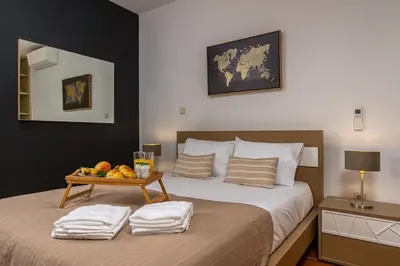 a bedroom with a bed with a tray of fruit on it at Villa Salinas in Paul do Mar