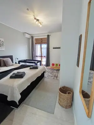 a hotel room with two beds and a mirror at LUX CITYWALK Appartments AIRCON in Funchal