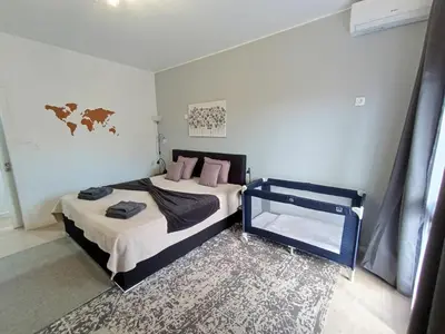 a room with a wooden dresser and a mirror at LUX CITYWALK Appartments AIRCON in Funchal