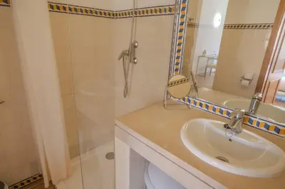 a bathroom with a sink and a shower at Ocean View with Private Terrace in Luz