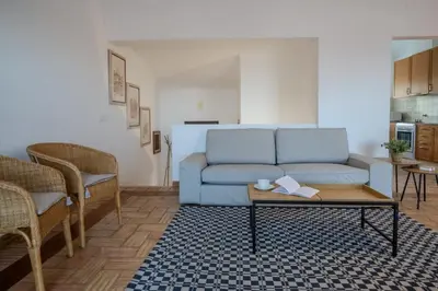 a living room with a couch and a coffee table at Ocean View with Private Terrace in Luz