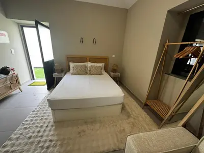 a bedroom with a large bed in a room at São Pedro Paradise A UP in Funchal