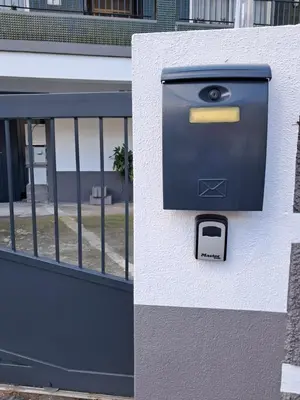 a mail box on the side of a building at Casa Martins in São Vicente