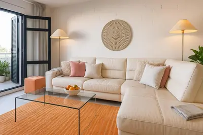 a living room with a couch and a glass table at Varandas do Sol - Private Sun Terrace close to Natural Pools & Praia Formosa in Funchal