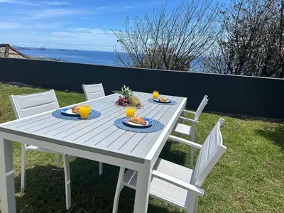 a table with plates of food and fruit on it at Anita & Leonel's House A in Gaula