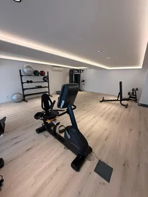 a room with a gym with exercise bikes in it at In-Town Residences in Funchal