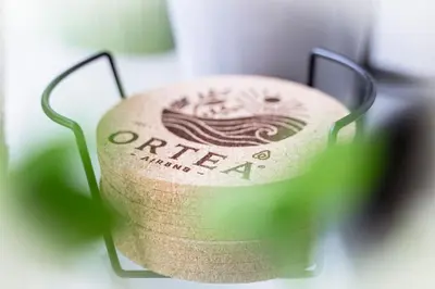 a close up of a wine bottle sitting on a table at Orteá Sea Breeze in Budens