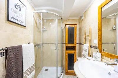 a bathroom with a sink and a shower at Casa da Fonte by YOUR KEY - 1st floor house in Ribeira Brava