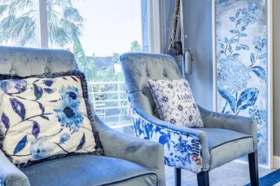 two blue and white chairs in a room with a window at Casa da Fonte by YOUR KEY - 1st floor house in Ribeira Brava