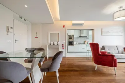a living room with a glass table and chairs at SeaSide Serenity II in Funchal