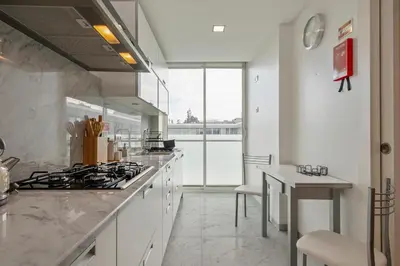 a kitchen with white counters and a stove top oven at SeaSide Serenity II in Funchal