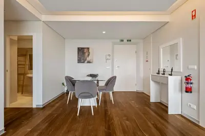 a dining room with a table and chairs at SeaSide Serenity II in Funchal