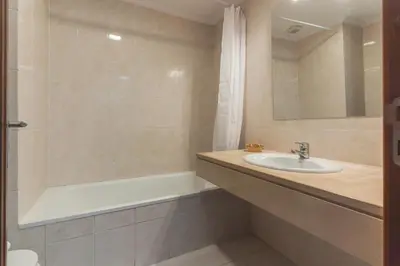 a bathroom with a sink and a bath tub at My Home Reis Magos by Atlantic Holiday in Caniço