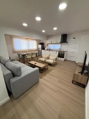 a living room with a couch and a table at Villas Sossego in Porto Santo