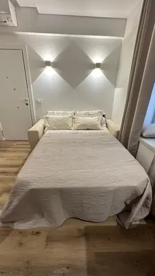 a bedroom with a large bed with two pillows at Se Urban Suite 22 in Funchal